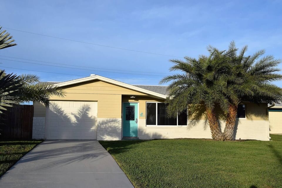 Exterior Front View of the home Freshly painted in cool hues.