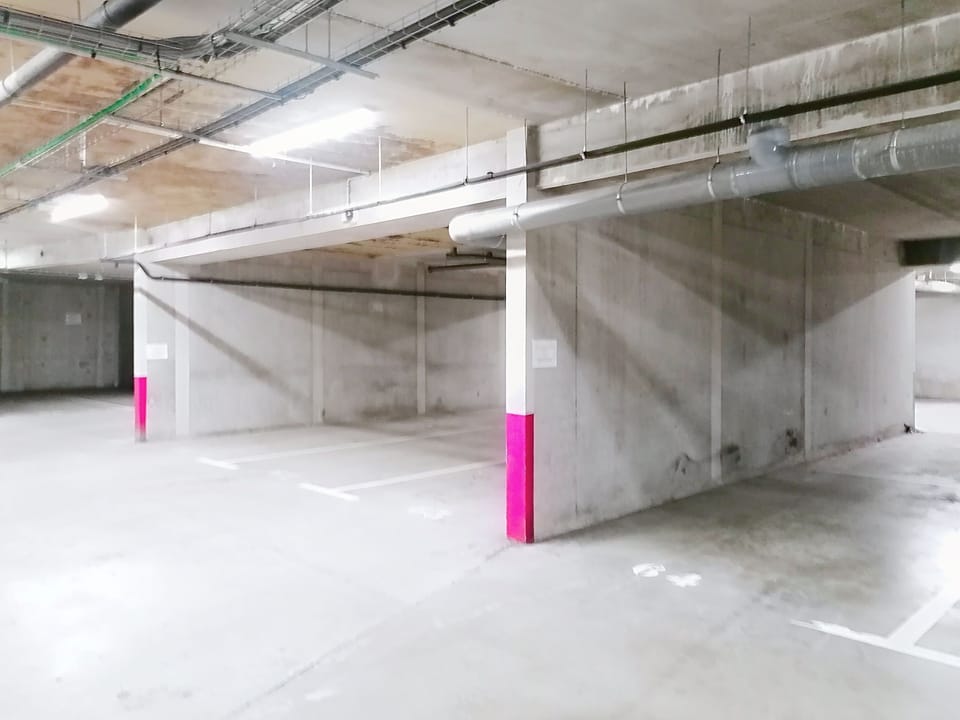 Indoor parking facility offering secure covered parking for guests.