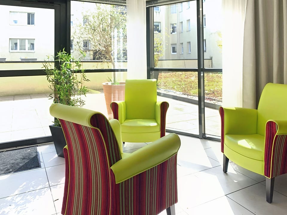 Lobby lounge with seating adjacent to the reception desk.