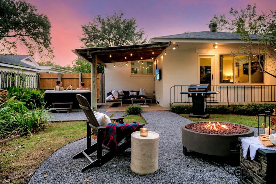 Unwind under string lights and pink skies with fireside treats and warm company