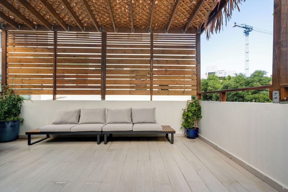 Find calmness and peace on this comfortable, covered deck for your morning coffee.

