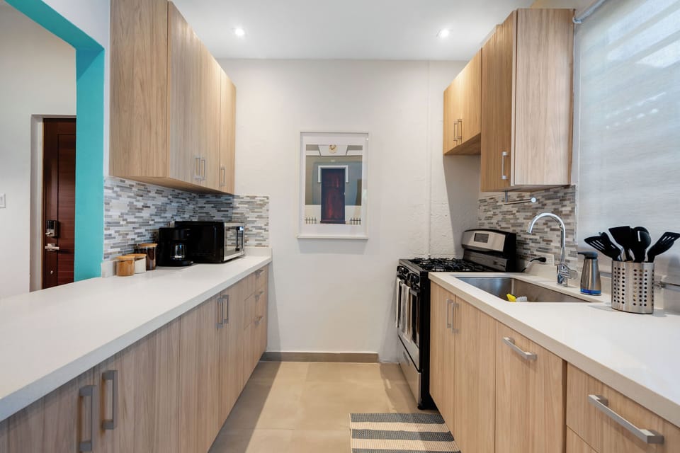 A bright and clean kitchen with ample counter space for all your culinary needs.

