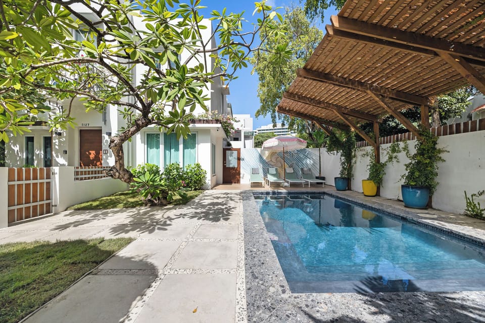 Your exclusive backyard with a pool and a covered patio for ultimate relaxation.
