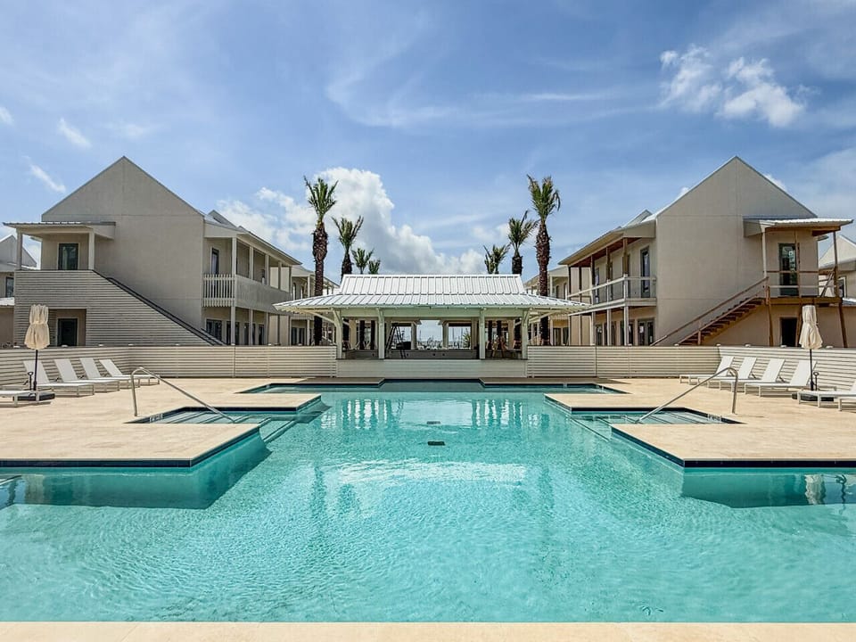 Resort-style pool with a sun deck and shaded cabana lounge—your perfect Pass Christian hideaway starts here.