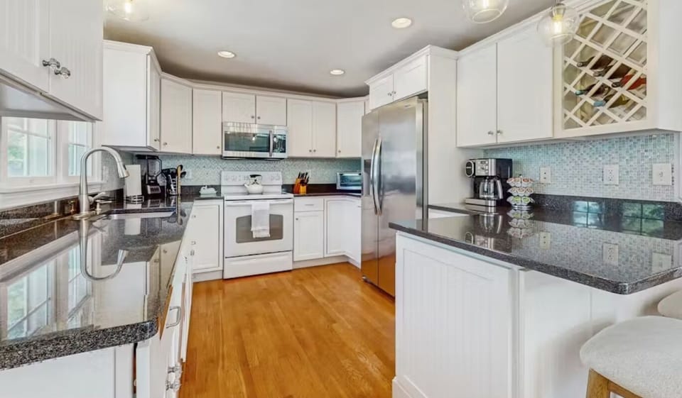 Kitchen featuring stainless steel appliances and granite countertops. 