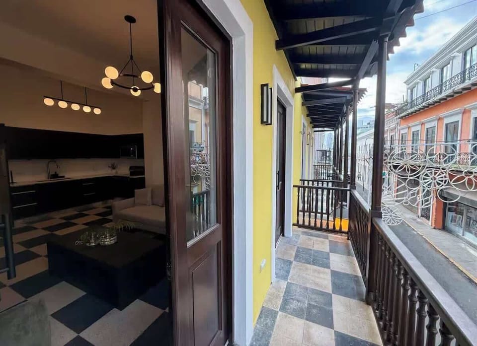 Sip your morning coffee above one of Old San Juan's colorful streets.