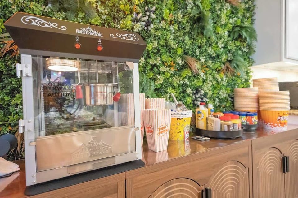 Fully stocked popcorn bar with assorted seasonings. 