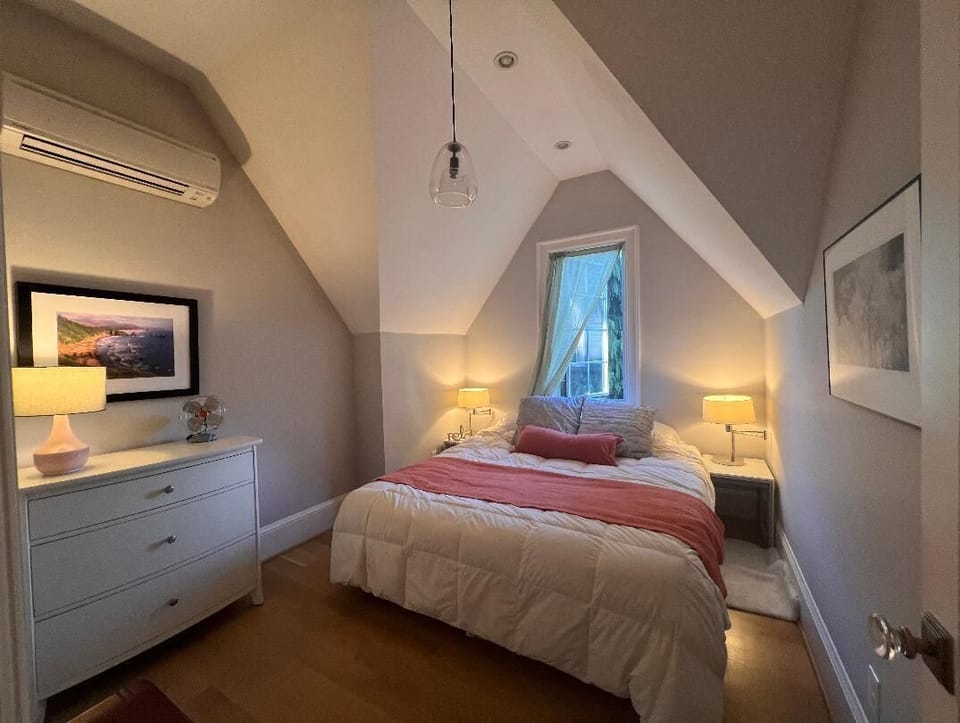Queen Bed with dresser and night tables in bedroom