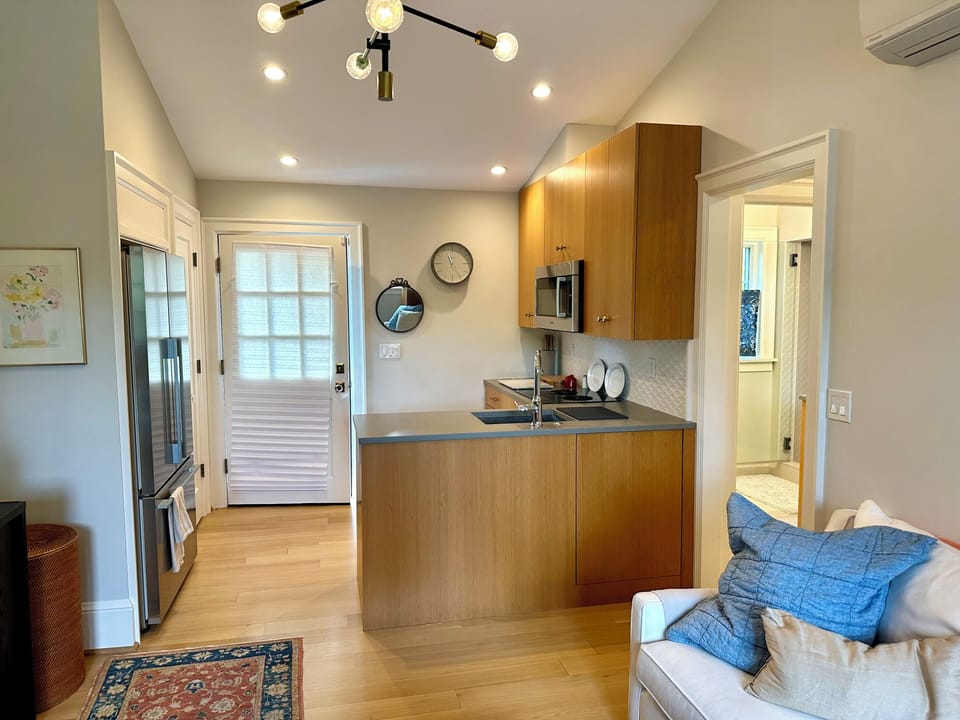View of kitchen and entrance from living room
