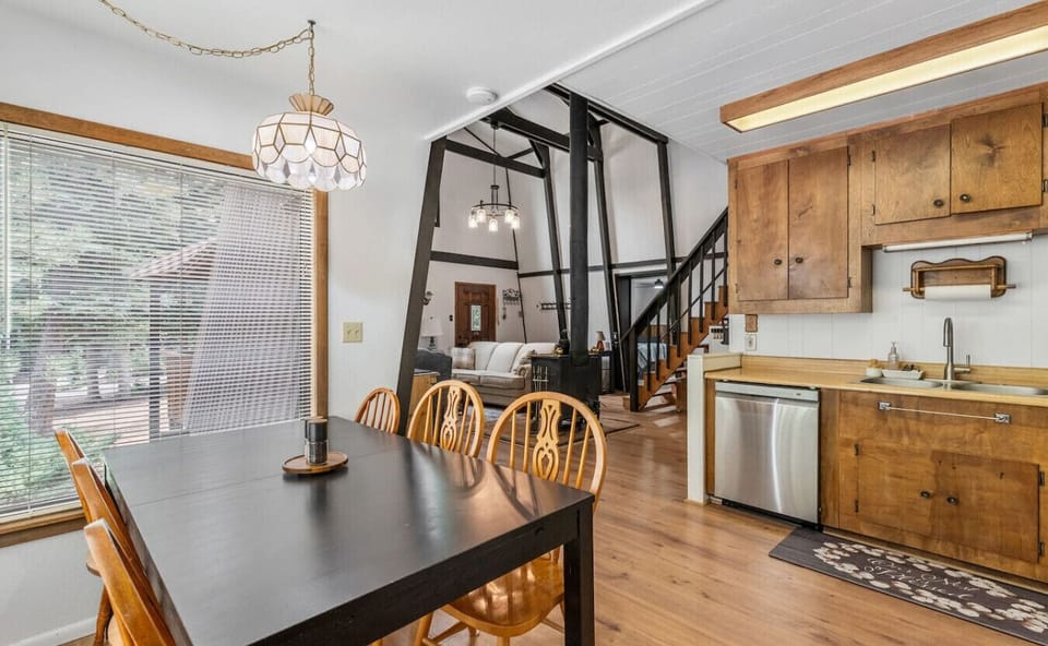 The open-concept dining area features a beautiful view of the surrounding landscape