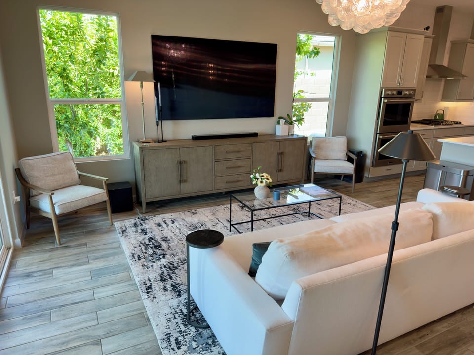 Great room with 85" 8k TV, soundbar, and subwoofer