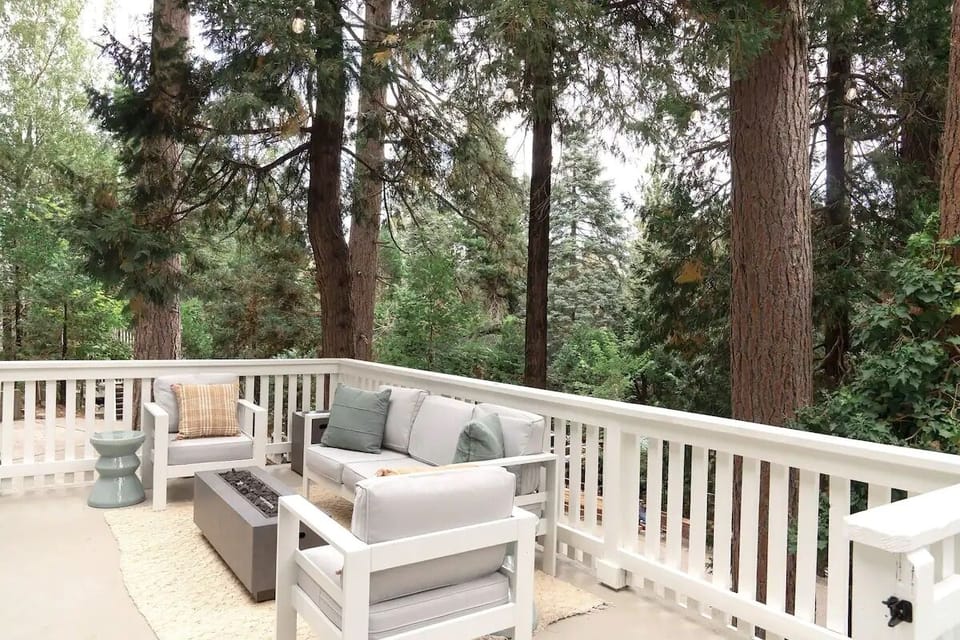 Front deck with string lights and firepit.