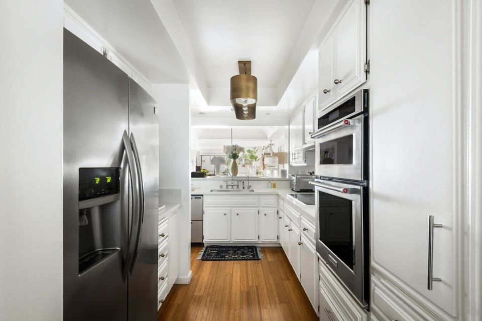 Whip up your favorites in this spacious, sleek kitchen—freshly stocked and ready for your stay.