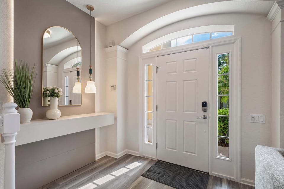 Elegant entryway with natural light and minimalist decor.