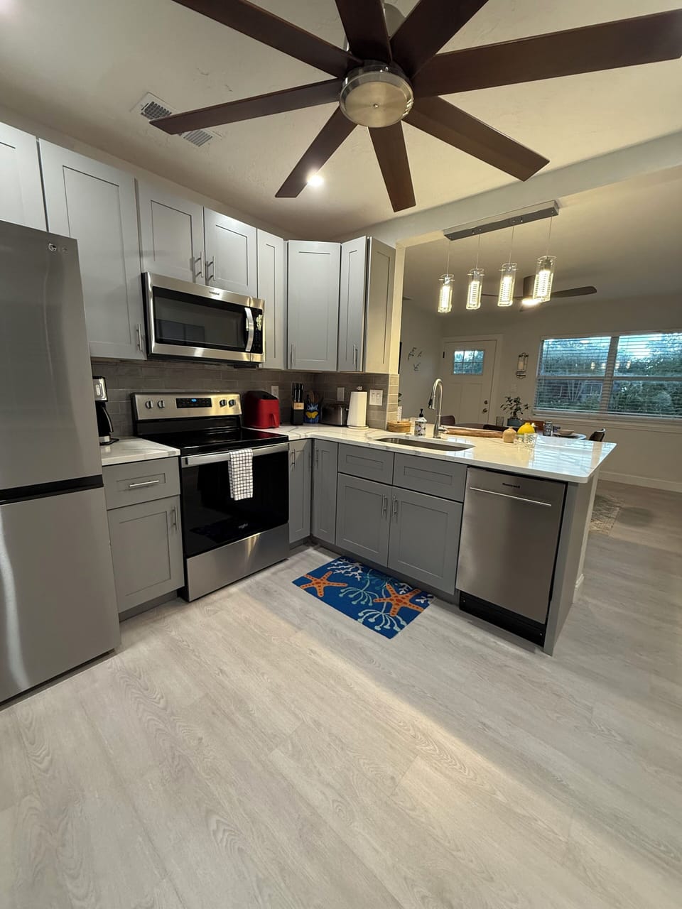 The fully remodeled and equipped kitchen also has a breakfast bar.