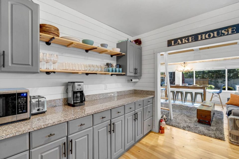 Charming modern kitchen with everything you need, including a coffee station.