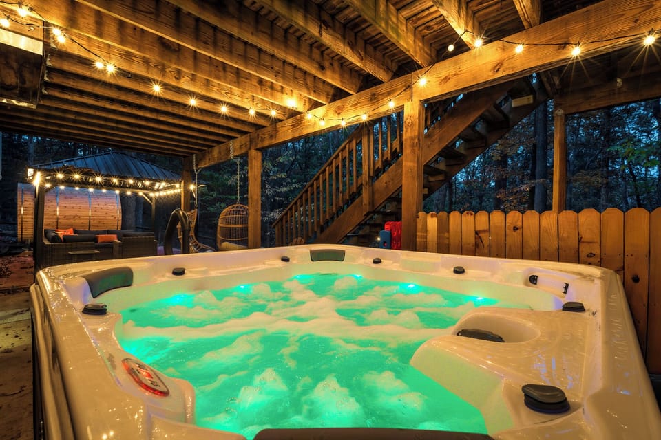 Evenings made better—soak under the string lights in our bubbling hot tub after a day of adventure