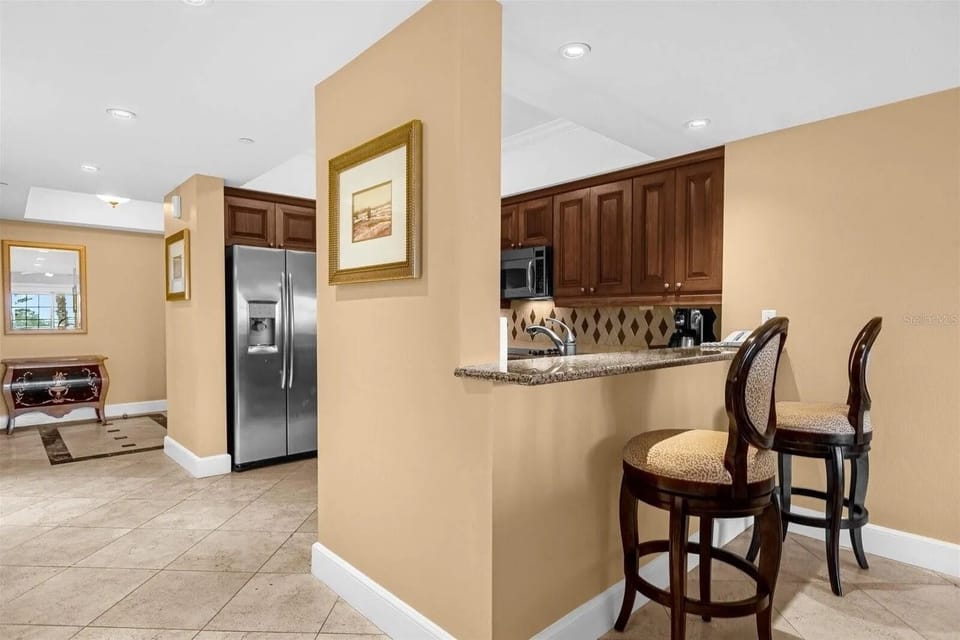 Fully Stocked Kitchen and Dining Area