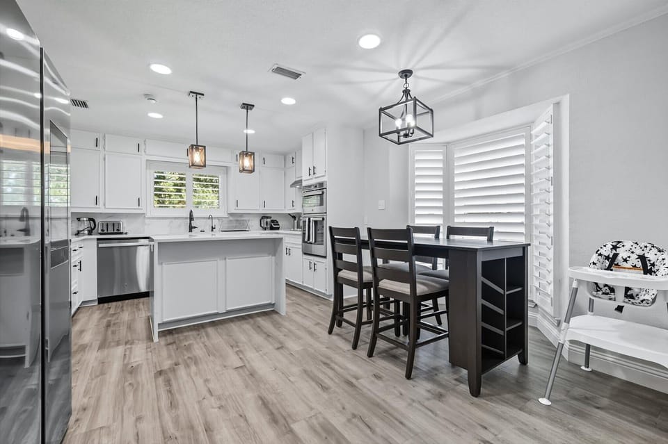 Undeniably the heart of the home, this spectacular kitchen features a center kitchen island, stainless steel appliances, and a cozy breakfast nook. 