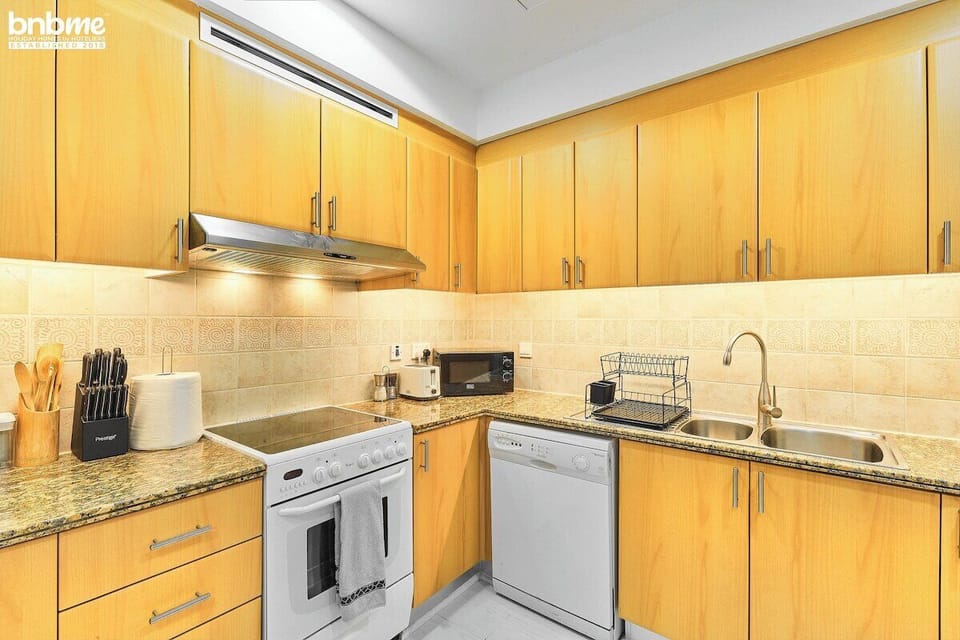 Kitchen: "Channel your inner chef in our modern kitchen equipped with all the essentials."