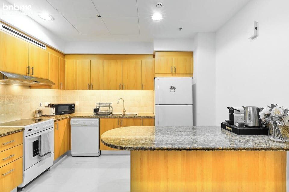 Kitchen: "Channel your inner chef in our modern kitchen equipped with all the essentials."