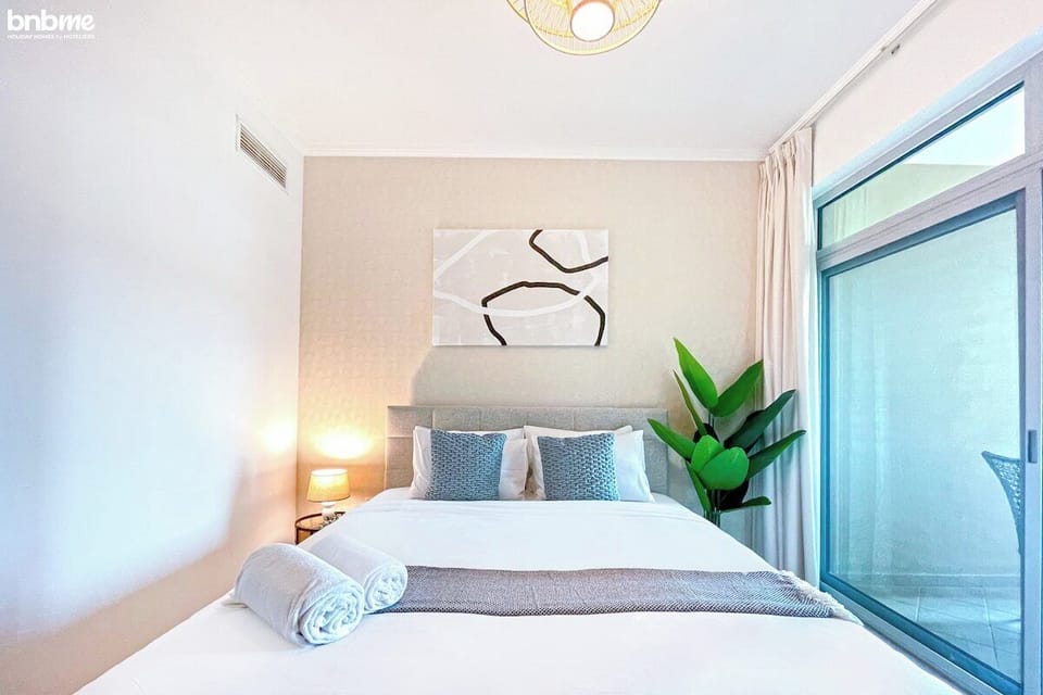 Rest like royalty in our spacious bedroom, featuring a luxurious king-sized bed.