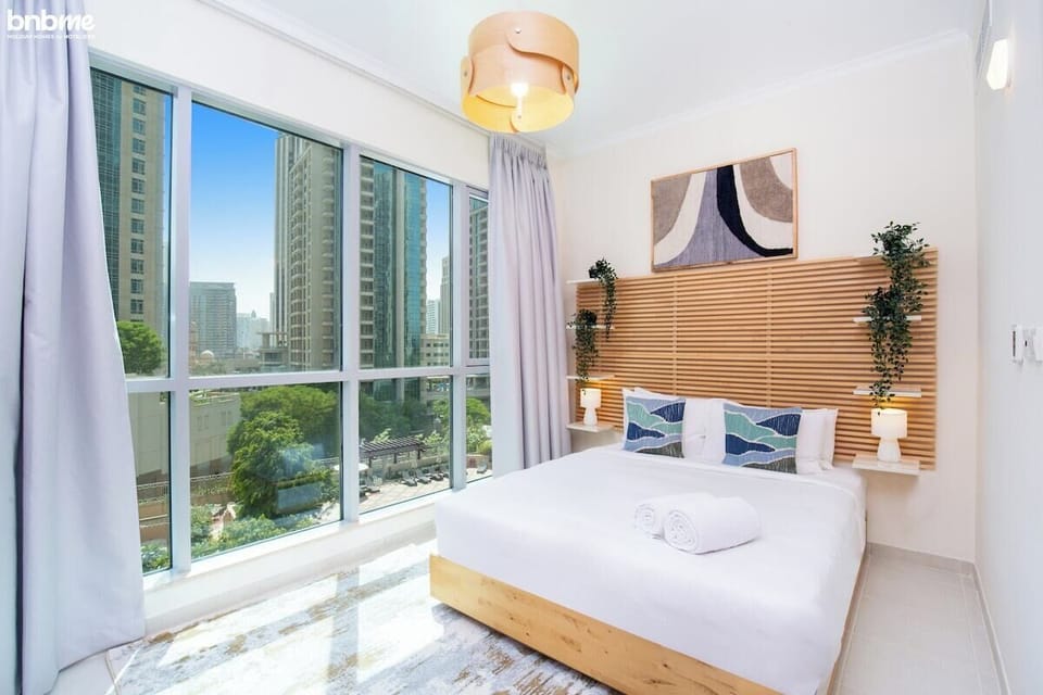 Rest like royalty in our spacious bedroom, featuring a luxurious king-sized bed.