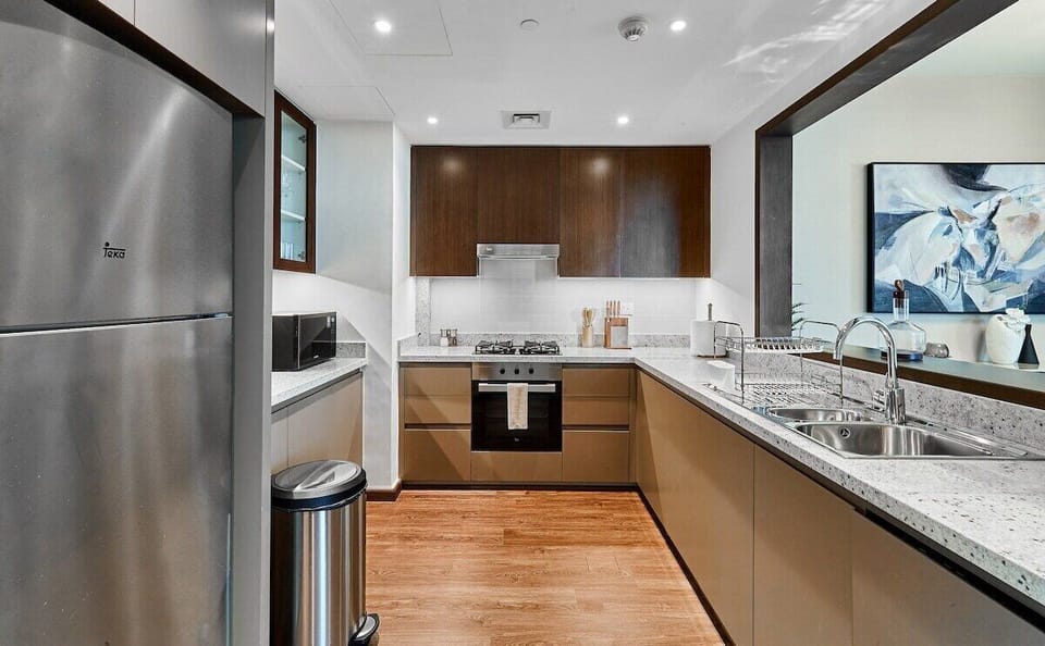 Kitchen: "Channel your inner chef in our fully equipped modern kitchen."