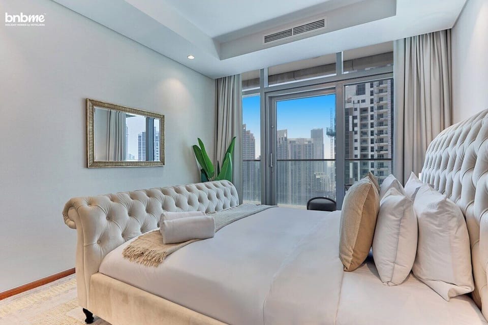 Bedroom : "Indulge in a restful night's sleep in our inviting bedroom featuring a plush king-sized bed and modern decor."