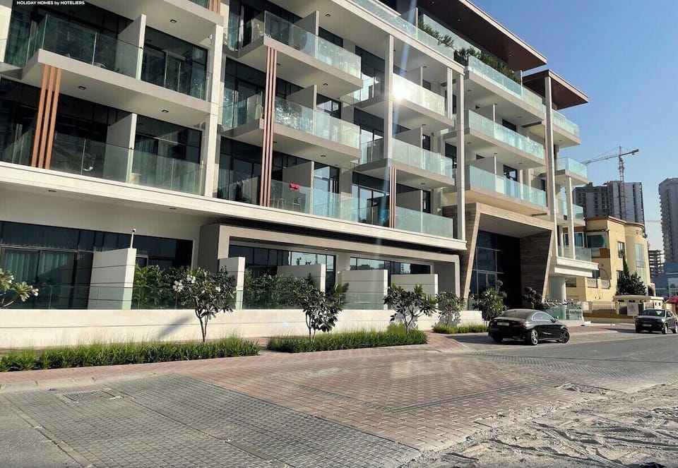 The building's modern exterior exudes elegance, surrounded by a clean and peaceful neighbourhood.