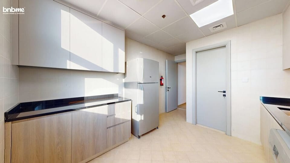 Whip up delicious meals in this sleek full kitchen featuring stainless-steel appliances, a gas stove, dishwasher, and a large fridge. Ample cabinet storage, natural light, and stunning sea views make it a dream setup for every guest chef.