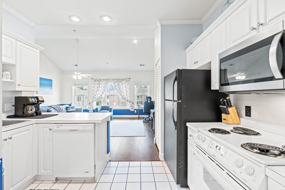 Open kitchen overlooking living space, perfect for staying connected and relaxed