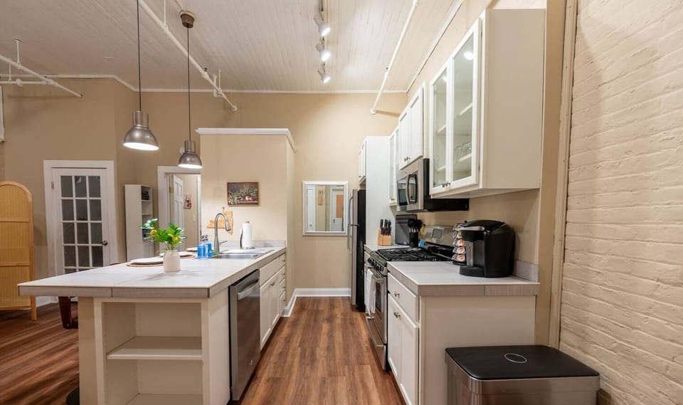 Cook with ease in this fully equipped kitchen, featuring modern appliances, bright lighting, and all the essentials to make every meal feel like home.