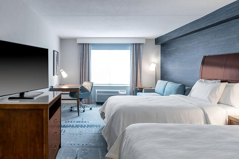 Settle into a spacious double-queen room with lounge seating.