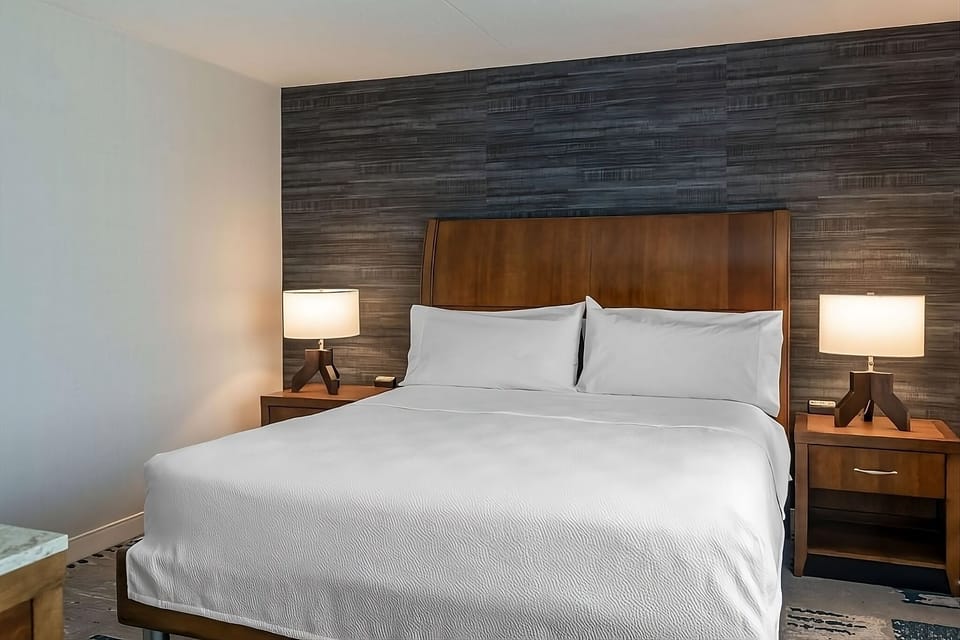 Drift off easily in a serene bed with soft glow.