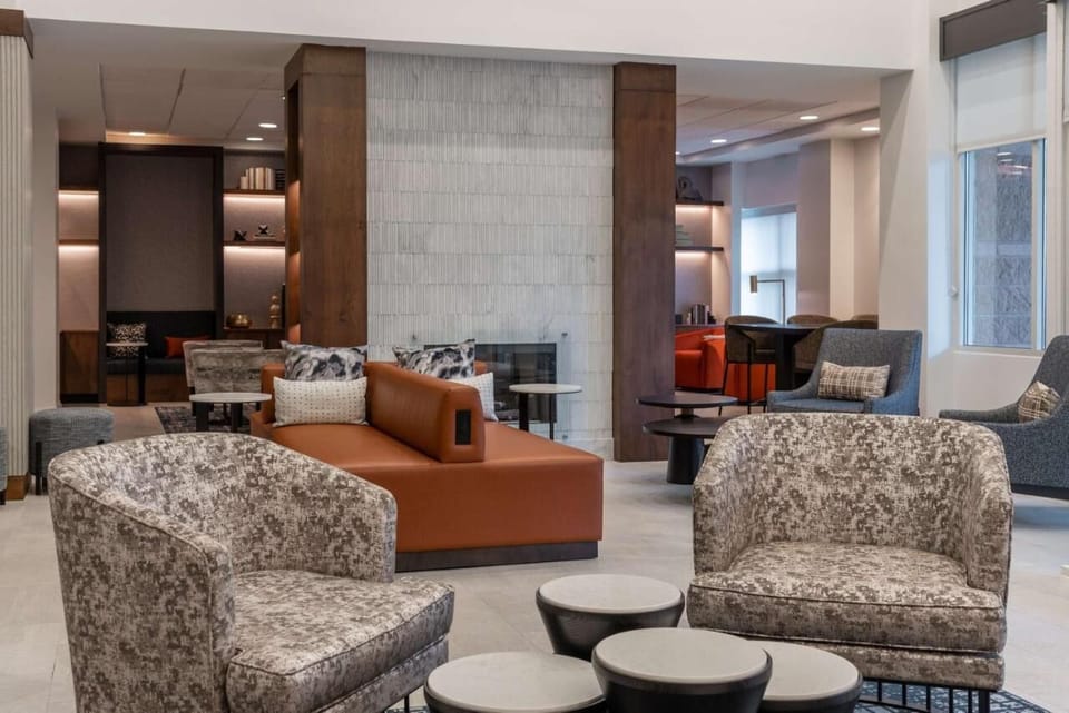 Sink into plush seating and unwind beside the glowing fireplace.