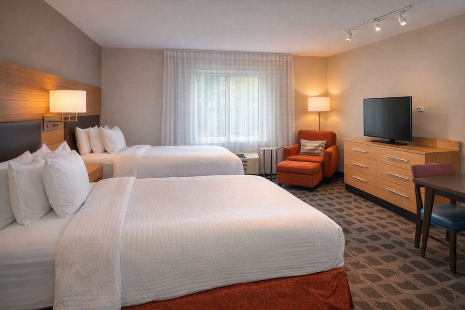 Sink into fresh linens and relax in a bright, quiet room.