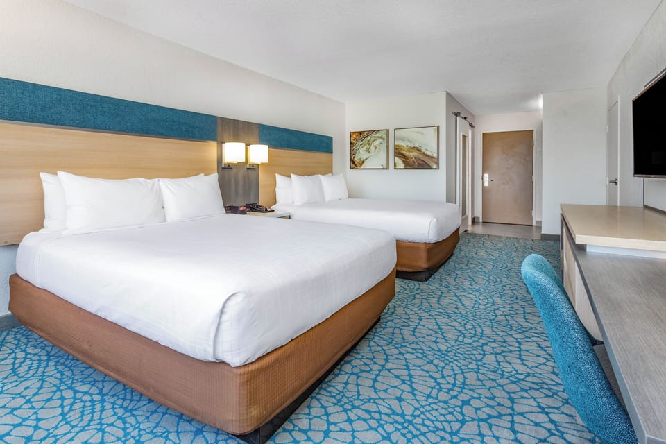 Stretch out on crisp linens in this spacious double-queen room.