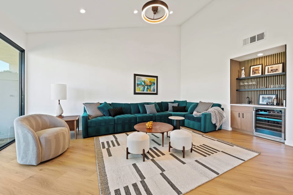 Stylish living room with cozy seating, a fireplace, and stunning golf course views.