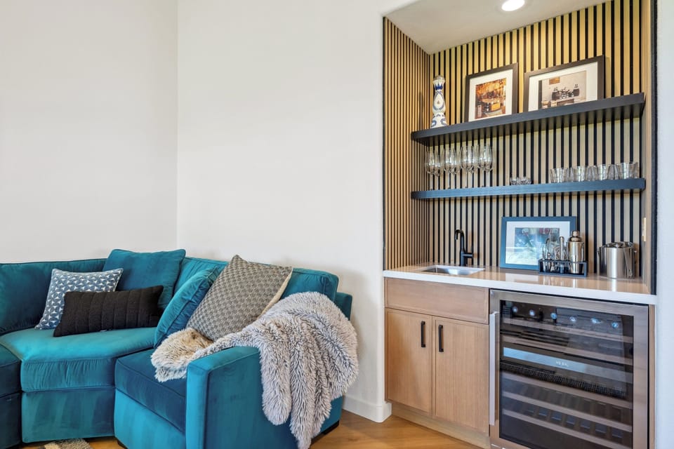 Modern design meets comfort in this spacious living area—perfect for lazy mornings or game nights.
