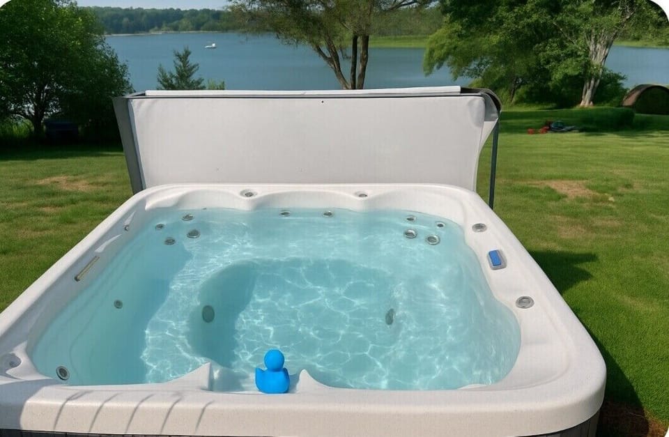 Relax and unwind in our inviting hot tub, perfectly positioned with serene lake views. Enjoy soothing jets, sparkling waters, and a peaceful setting—ideal for recharging after a busy day or sharing a tranquil evening under the stars.