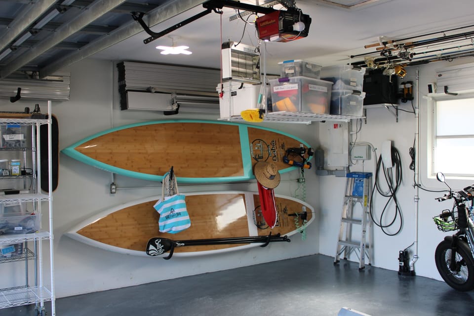 Paddle boards in garage