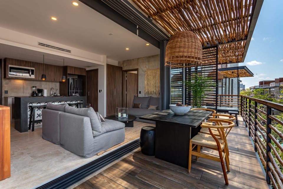 outdoor dining with doors that are wide open for open air company. 
