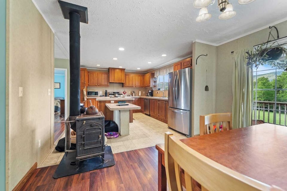 Bright, airy kitchen seamlessly connected to dining area.