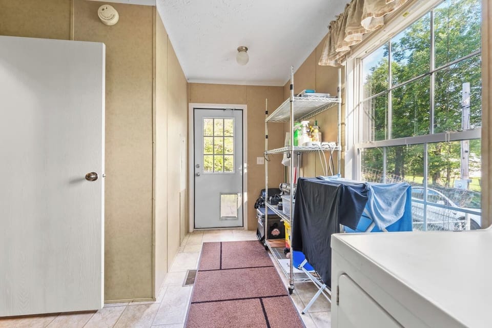 Doggie door leads straight to a safe, enclosed outdoor space for pets.