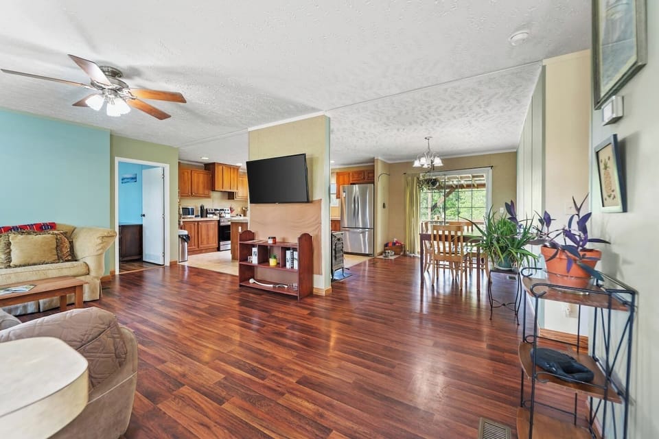 Spacious open-concept living room seamlessly flows into the dining area for effortless entertaining.