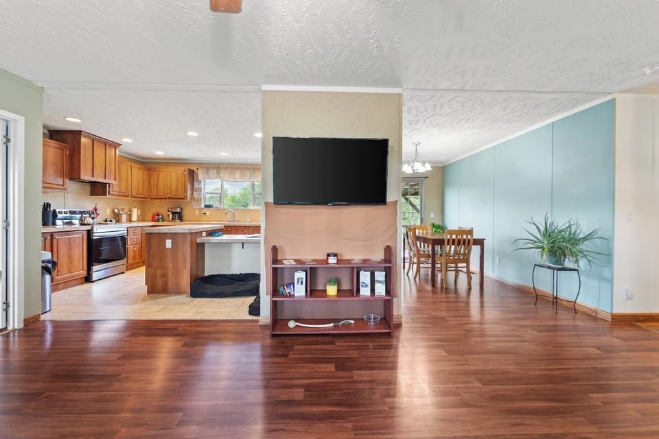 Comfortable living room leading straight into the kitchen for effortless hosting.