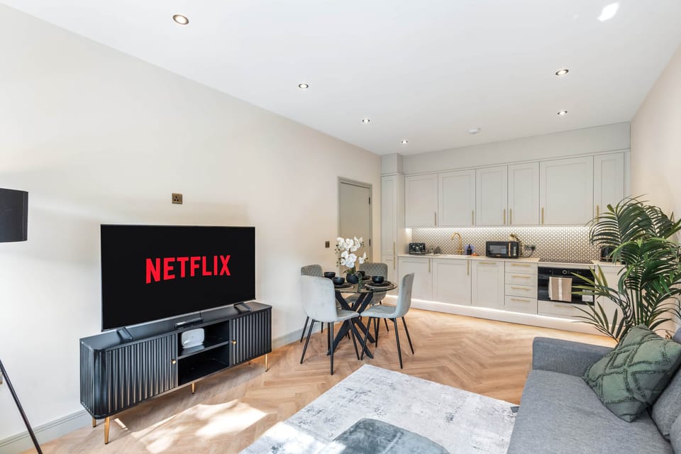 Dining table seating four guests, ideal for meals or remote working.