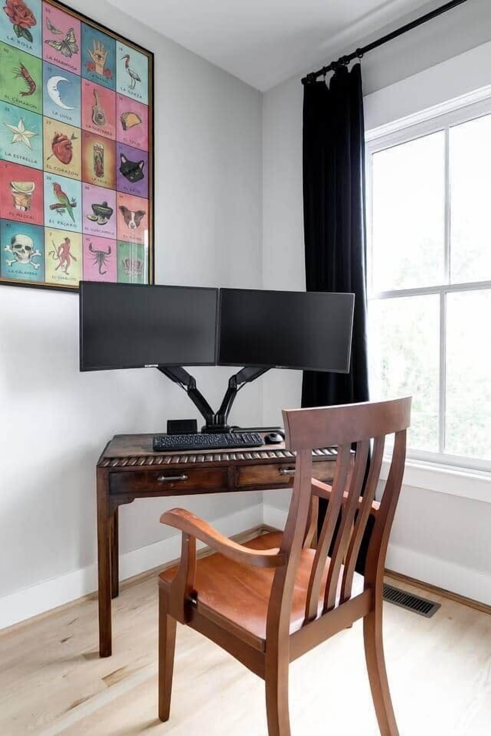 Mini office with universal docking station (USB-C) and dual widescreen monitors, keyboard, and mouse. 
