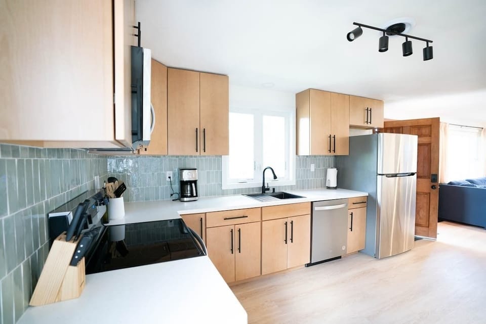 Unleash your inner chef as you cook a meal with your friends and family in this open concept kitchen with brand new appliances. 